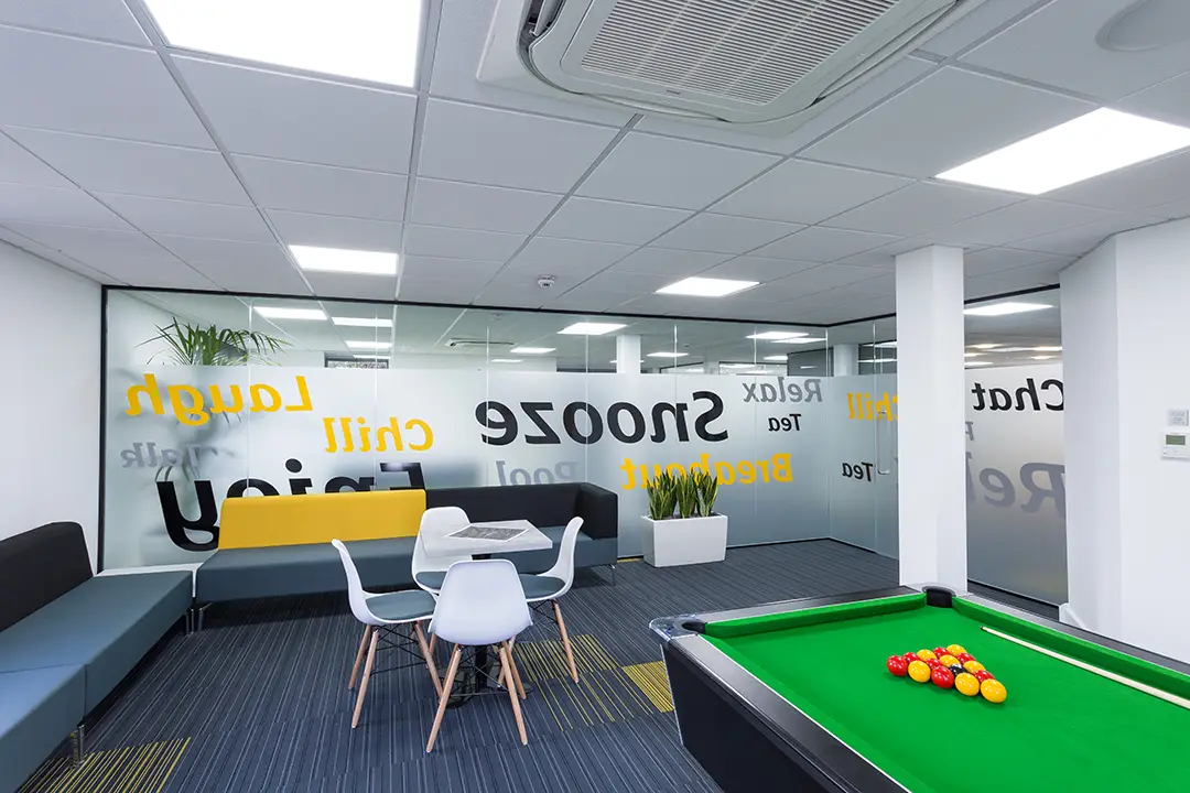An image of the Davis Construction staff area with pool table and comfortable seating area