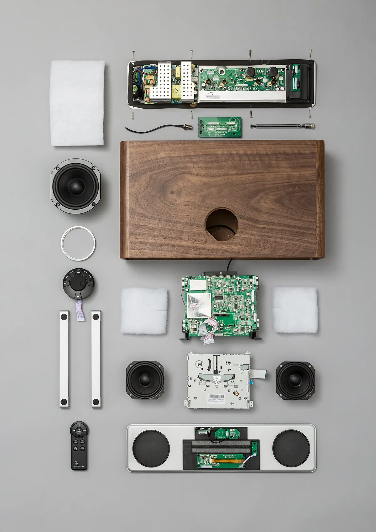 An image of a Ruark R4 system, with all it's internal components laid out next to it in a knowing style